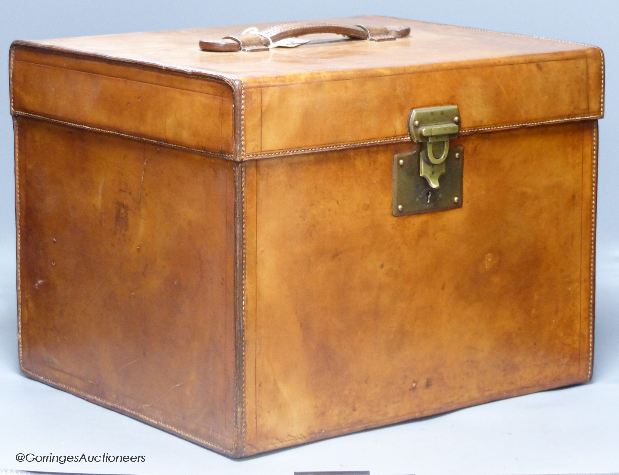 A brown hide travelling case